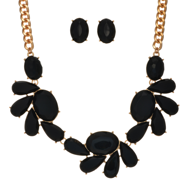Gold tone necklace set featuring large black multiple shaped cabochons. Approximately 15" in length.