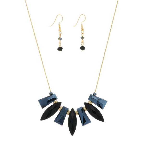 Gold tone necklace set featuring black multiple shaped cabochons with rhinestone accents. Approximately 16" in length.