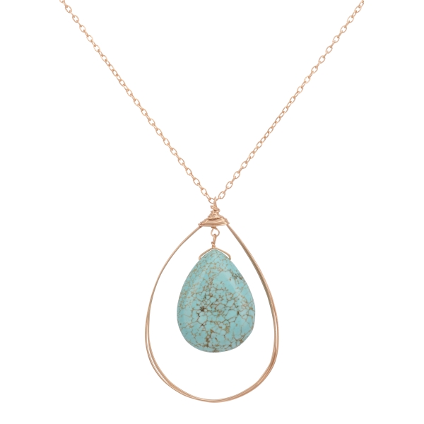 Gold tone necklace set featuring a wire teardrop shape with a hanging turquoise natural stone. Approximately 30" in length.