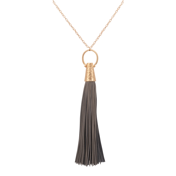 Gold tone necklace featuring a large gray leather tassel. Approximately 30" in length.