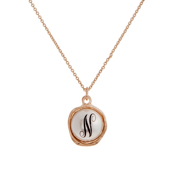 Wholesale gold monogram necklace displaying ivory faux pearl initial N Includes