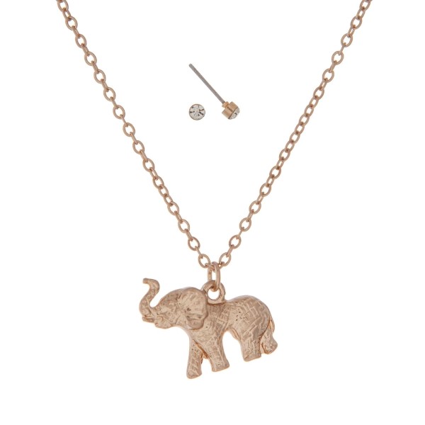 Dainty gold tone necklace set featuring an elephant pendant. Approximately 18" in length. 