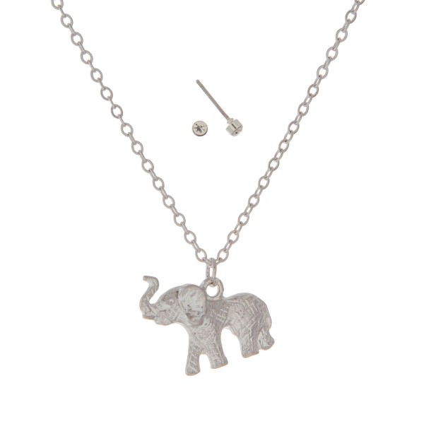 Dainty silver tone necklace set featuring an elephant pendant. Approximately 18" in length. 