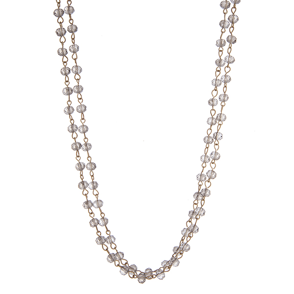 Gold tone black diamond beaded wrap necklace. Approximately 60" in length. 