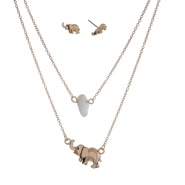 Dainty double layer necklace with an elephant pendant and a white chip stone. Approximately 16" in length. 