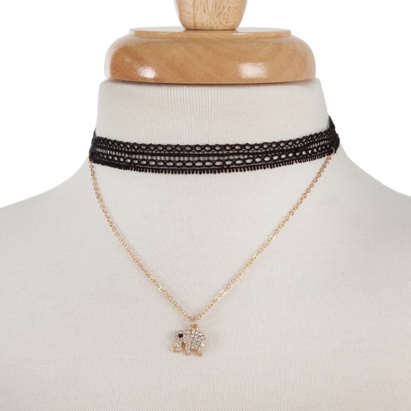 Double layer gold tone choker necklace with an elephant pendant. Approximately 14" in length.