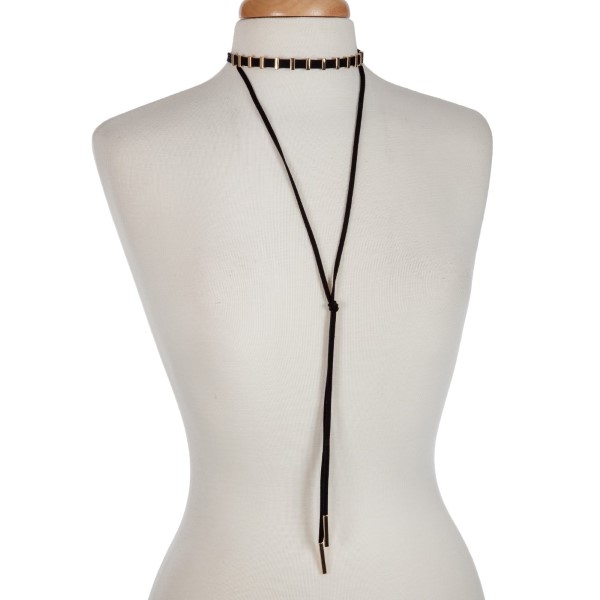 Black cord layered choker necklace with gold tone hardware. Approximately 14" in length.