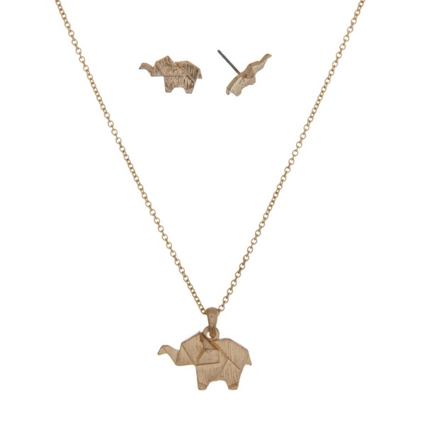 Dainty gold tone necklace with an origami elephant pendant. Approximately 16" in length. 