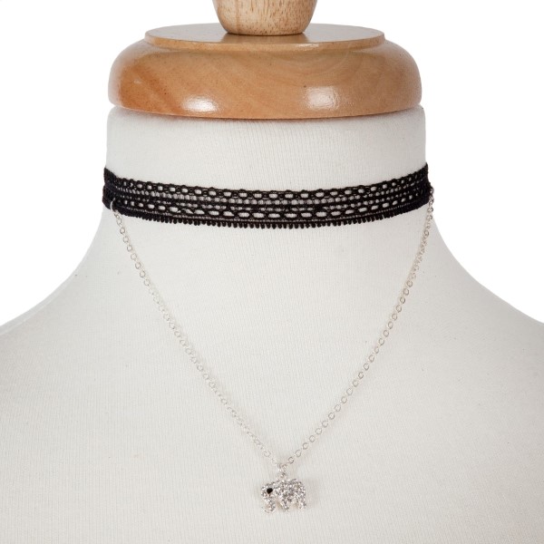 Double layer silver tone choker necklace with an elephant pendant. Approximately 14" in length. 