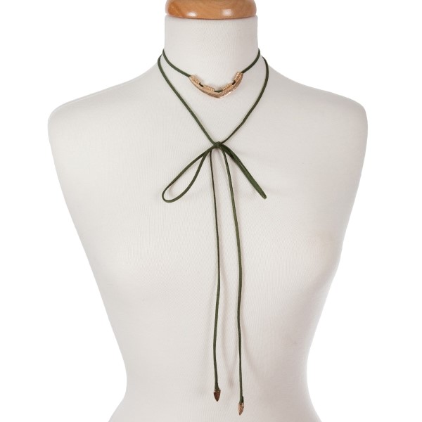 Olive green suede wrap necklace with an adjustable short layer displaying a hammered silver tone triangle and arrowheads on the long ends. Can be adjusted to any length up to 36 inches. 