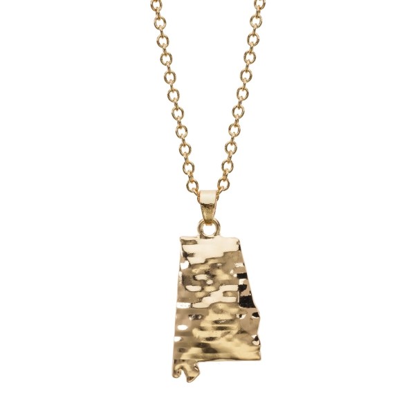 Gold tone necklace with a hammered pendant in the shape of Alabama. Approximately 18" in length. 