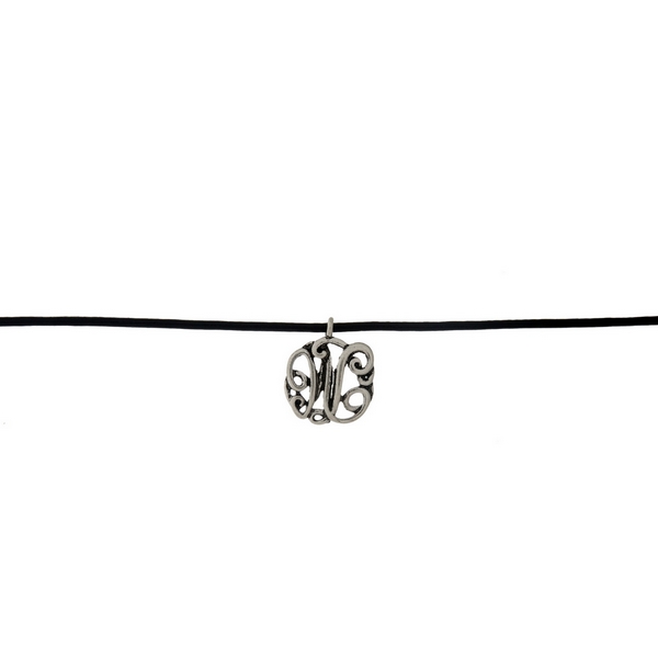 Black waxed cord choker with a silver tone script 'W' initial. Approximately 12" in length. 