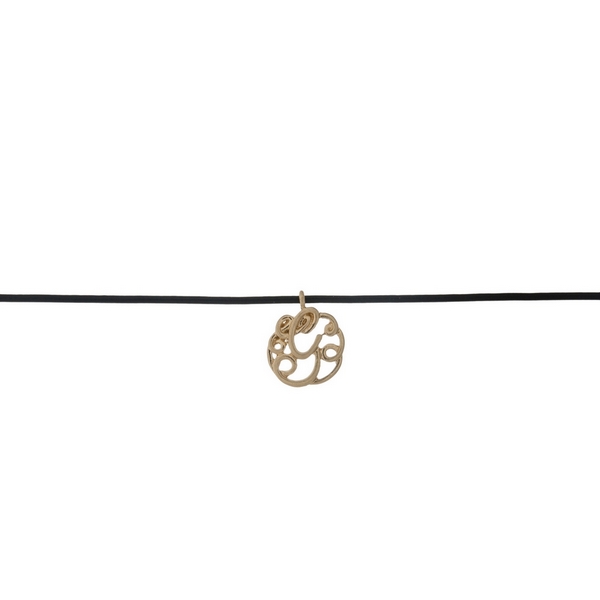 Black waxed cord choker with a gold tone script 'G' initial. Approximately 12" in length. 