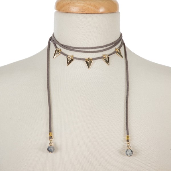 Gray suede cord choker necklace with gold tone arrowheads and gray jasper beads. Adjustable in length. Handmade in the USA. 