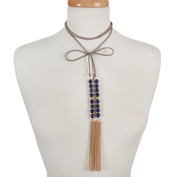 Gray faux suede wrap choker with blue natural stone beads and gold tone chain tassels. Approximately 12" in length. 