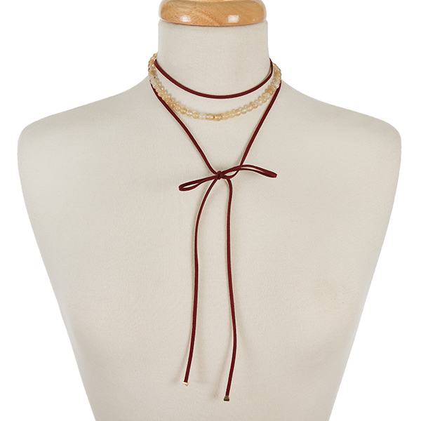 Burgundy faux suede and beige natural stone, beaded wrap choker with gold tone accents. Approximately 12" in length. 