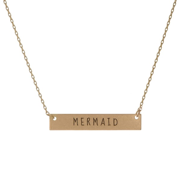 Matte gold tone bar necklace stamped with "Mermaid." Approximately 14" in length.