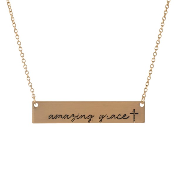 Dainty gold tone necklace with a bar pendant, stamped with "Amazing Grace." Approximately 16" in length. 