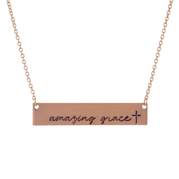 Dainty rose gold tone necklace with a bar pendant, stamped with "Amazing Grace." Approximately 16" in length. 