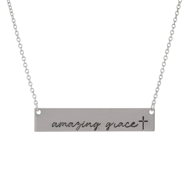 Dainty silver tone necklace with a bar pendant, stamped with "Amazing Grace." Approximately 16" in length. 