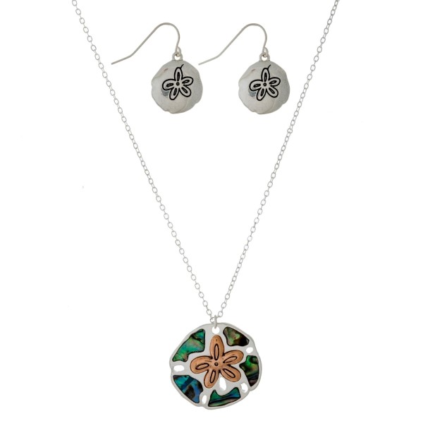 Silver tone necklace set with a two-tone and abalone beach pendant. Approximately 16" in length. 