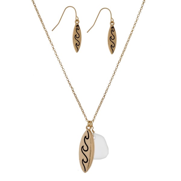 Dainty necklace set with a wave and sea glass pendant. Approximately 16" in length. 