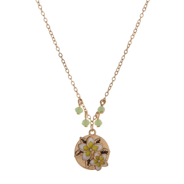 Gold tone necklace with sea life pendant stamped with "Paradise Found." Approximately 16" in length. 