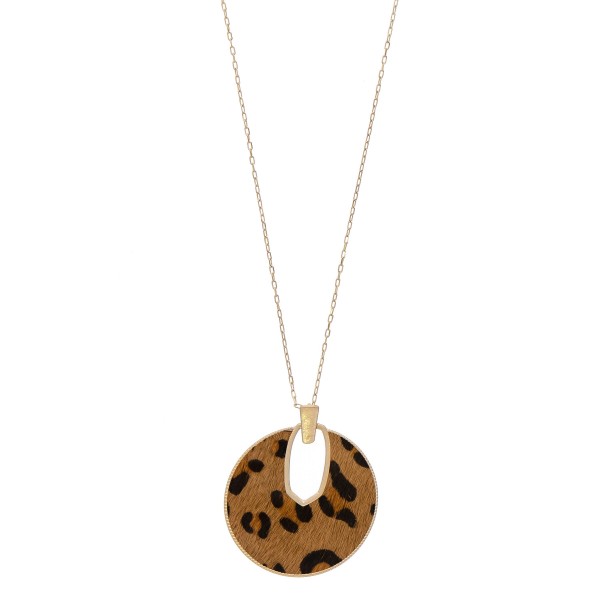 Cowhide leopard print encased disc pendant necklace.

- Pendant approximately 2.5" in diameter
- Approximately 34" in length overall