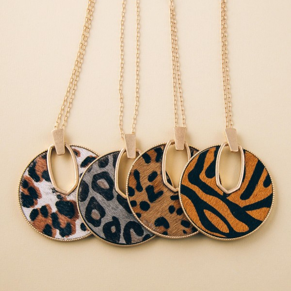 Cowhide leopard print encased disc pendant necklace.

- Pendant approximately 2.5" in diameter
- Approximately 34" in length overall