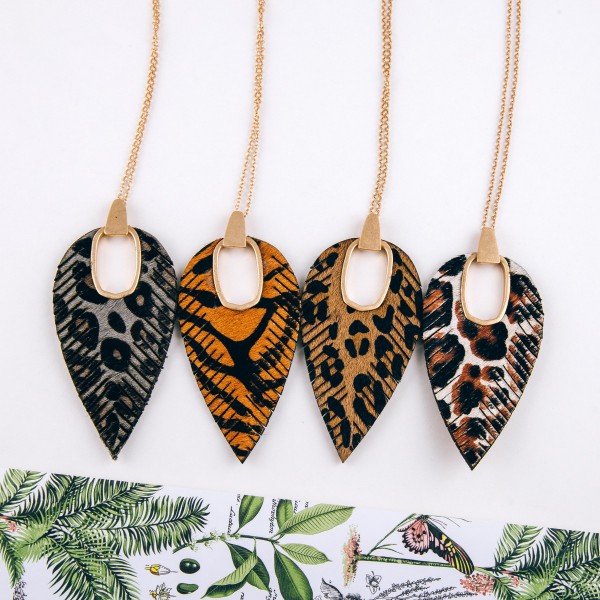 Cowhide leopard print hinge cut out pendant necklace.

- Pendant approximately 4" in length
- Approximately 38" in length overall