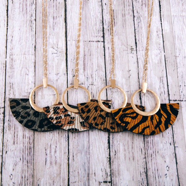 Faux leather cowhide leopard print tassel pendant necklace.

- Pendant approximately 3" in length
- Approximately 36" in length overall