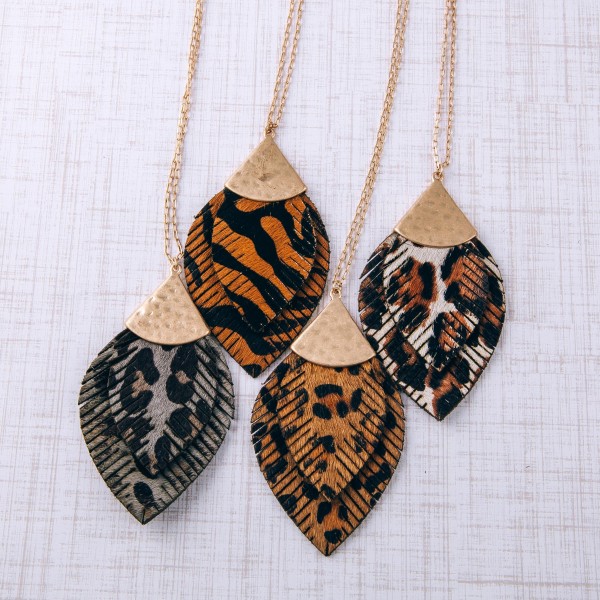 Long doubled genuine leather leopard print feather pendant necklace.

- Pendant approximately 3.5" in length
- Approximately 36" in length overall with 3" extender