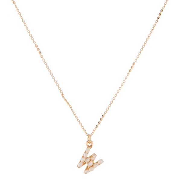 Gold pearl initial W pendant necklace.

- Pendant approximately .5" in size
- Approximately 15" in length overall with 3" extender