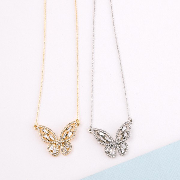Rhinestone butterfly pendant necklace.

- Pendant approximately 1" 
- Approximately 18" L 
- 2.5" extender