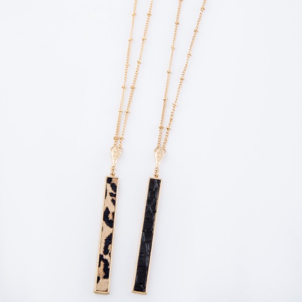 Long Leopard Print Bar Necklace.

- Pendant 3" L
- Approximately 36" L overall
- 3" Adjustable Extender