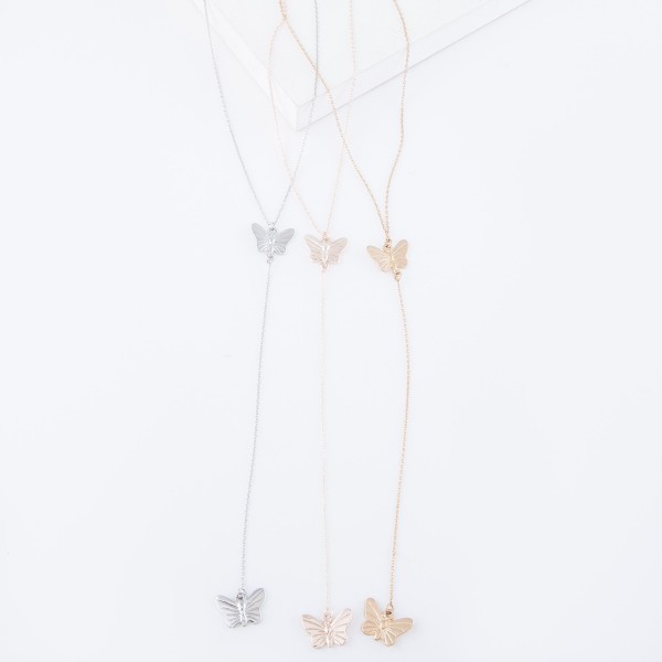 Rose Gold Y necklace featuring a thin chain and butterfly pendants 
- Approximately 16" L, Y pendant is approximately 26" L 
- Features a 3" extender