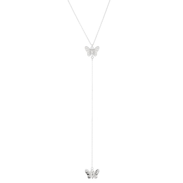 Silver Y necklace featuring a thin chain and butterfly pendants 
- Approximately 16" L, Y pendant is approximately 26" L 
- Features a 3" extender