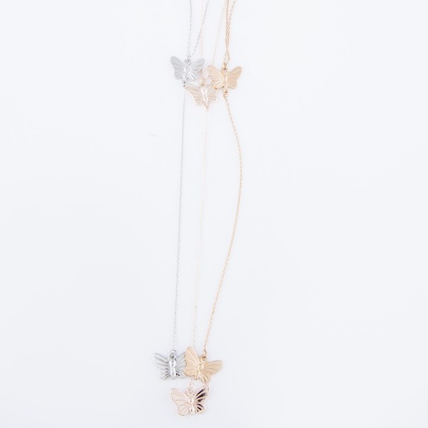 Silver Y necklace featuring a thin chain and butterfly pendants 
- Approximately 16" L, Y pendant is approximately 26" L 
- Features a 3" extender