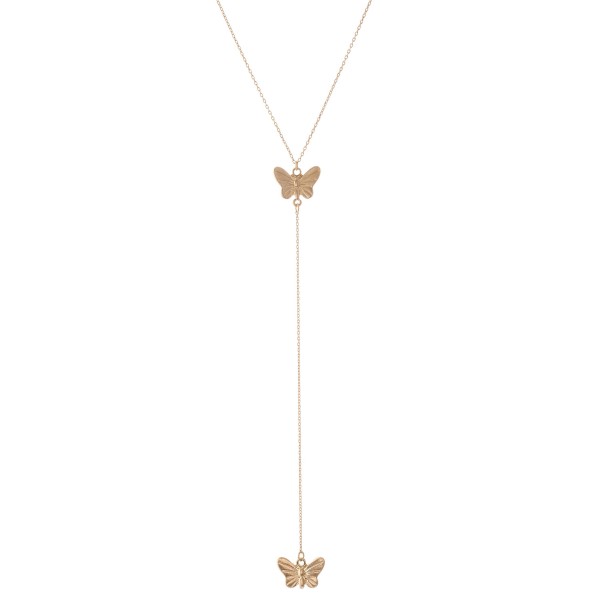 Gold Y necklace featuring a thin chain and butterfly pendants 
- Approximately 16" L, Y pendant is approximately 26" L 
- Features a 3" extender