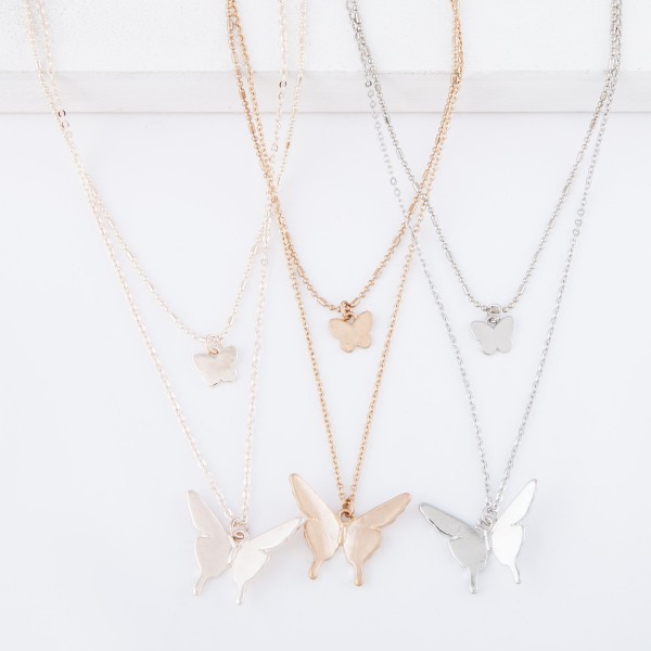 Short Double layered silver necklace with butterfly pendants. 
- Shorter chain measures approximately 14" L & longer chain measures approximately 17" L 
- Features a 3.5" extender 