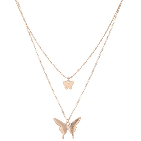 Short Double layered gold necklace with butterfly pendants. 
- Shorter chain measures approximately 14" L & longer chain measures approximately 17" L 
- Features a 3.5" extender 