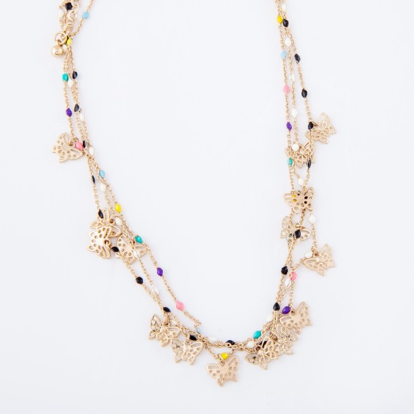 Short gold necklace featuring beaded accents and small filigree butterfly charms. 
- Approximately 16" L with 3" extender 


