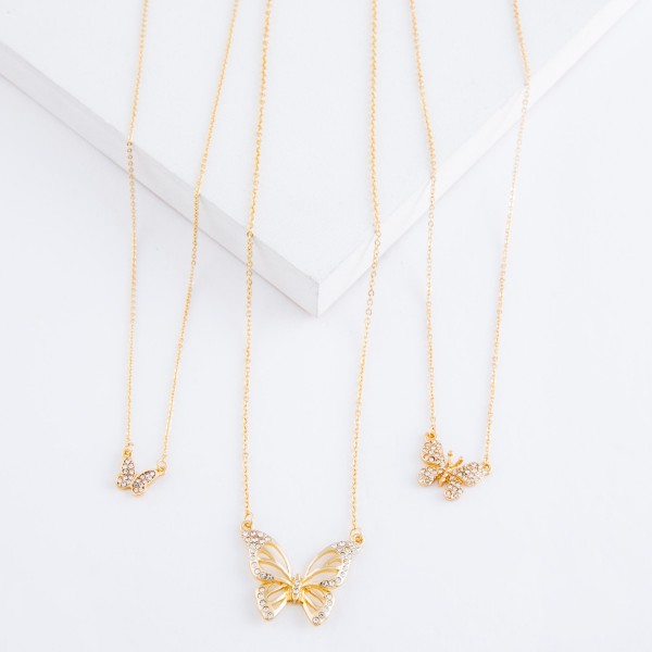 Gold rhinestone butterfly pendant necklace.

- Pendant approximately 1" 
- Approximately 18" L overall
- 2" extender