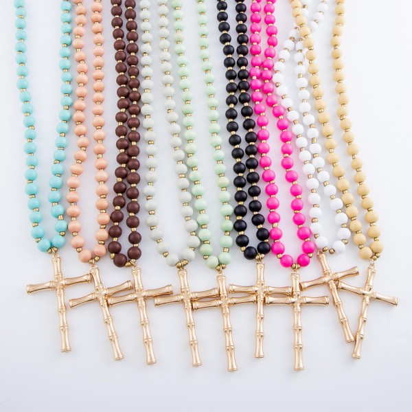 Wood Beaded Bamboo Cross Statement Necklace.

- Pendant 3" 
- Approximately 40" L overall
- 3" Adjustable Extender