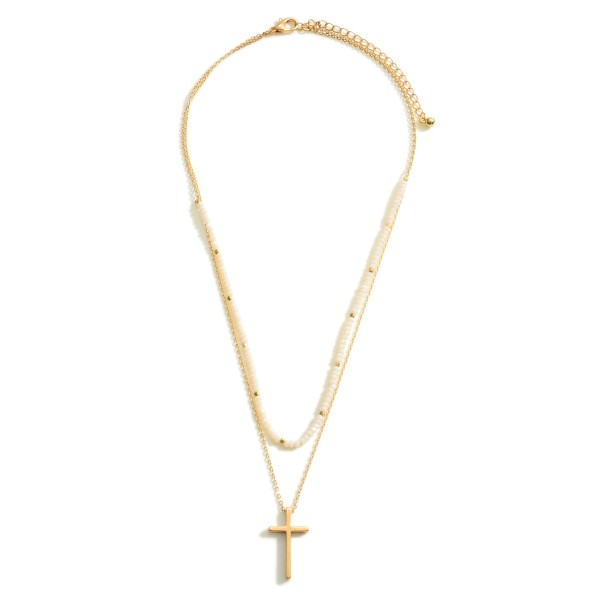 Layered Gold Necklace Featuring a Cross Pendant and Beaded Accents.

- Approximately 7.5" in Length
- Extender Approximately 3" in Length