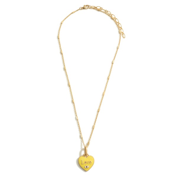 Gold Necklace Featuring a Heart Pendant that Says "Love"

- Approximately 9.5" in Length
Long Wooden Beaded Necklace Featuring Gold Accents.

- Approximately 15" in Length
- Extender Approximately 3" in Length