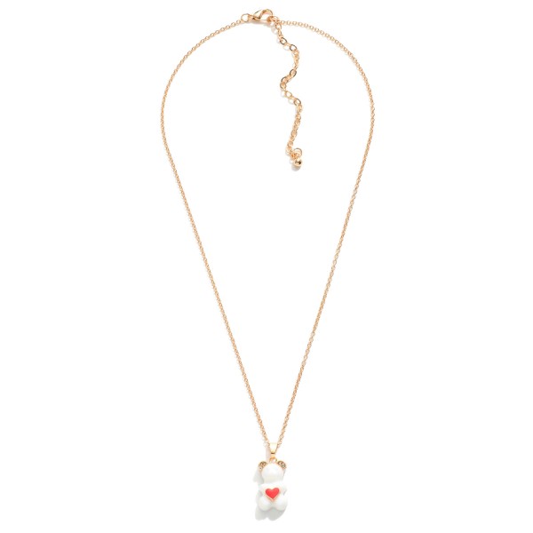 Short Gold Tone Necklace Featuring Candy Bear Charm With Rhinestone Accents and Enamel Heart

- Approximately 16" Length
- 3" Extender