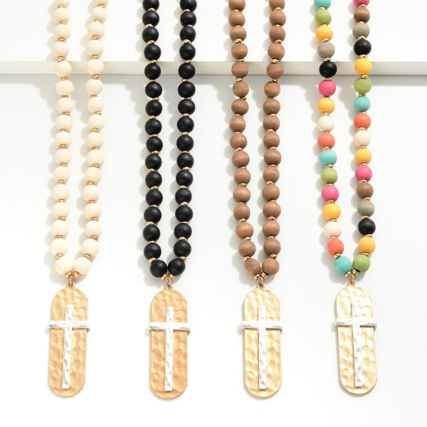 Wood Beaded Necklace With Hammered Cross Pendant 
- Approximately 28 " L
- Extender 3" L
- Pendant 2.25" L / 0.75" W
