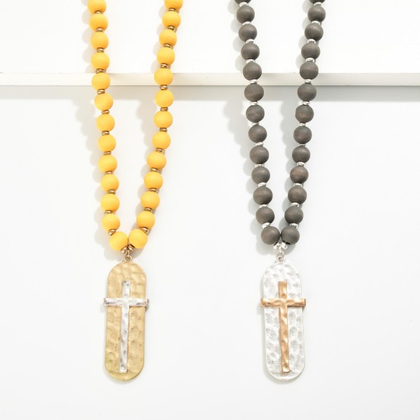 Wood Beaded Necklace With Hammered Cross Pendant 

- Approximately 28 " L
- Extender 3" L
- Pendant 2.25" L / 0.75" W 