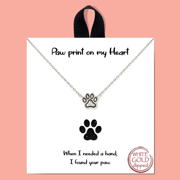 Dainty Chain Link Necklace Featuring Paw Print Pendant 

- Approximately 16" L
- Extender 2" L
- Hypoallergenic Brass Base
- 18K Gold or White Gold Dipped
- Made in Korea 
- Card : " When I needed a hand, I found your paw. " 